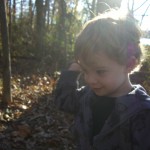 Caleb plays with leaves
